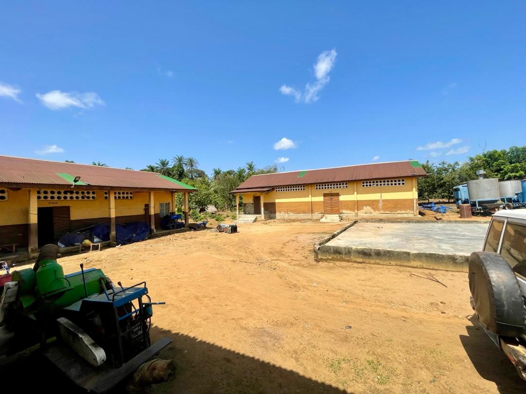 Agricultural facility with storage buildings and machinery